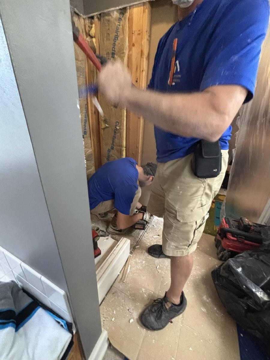 Installer performing hands-on accessibility modification work in a home