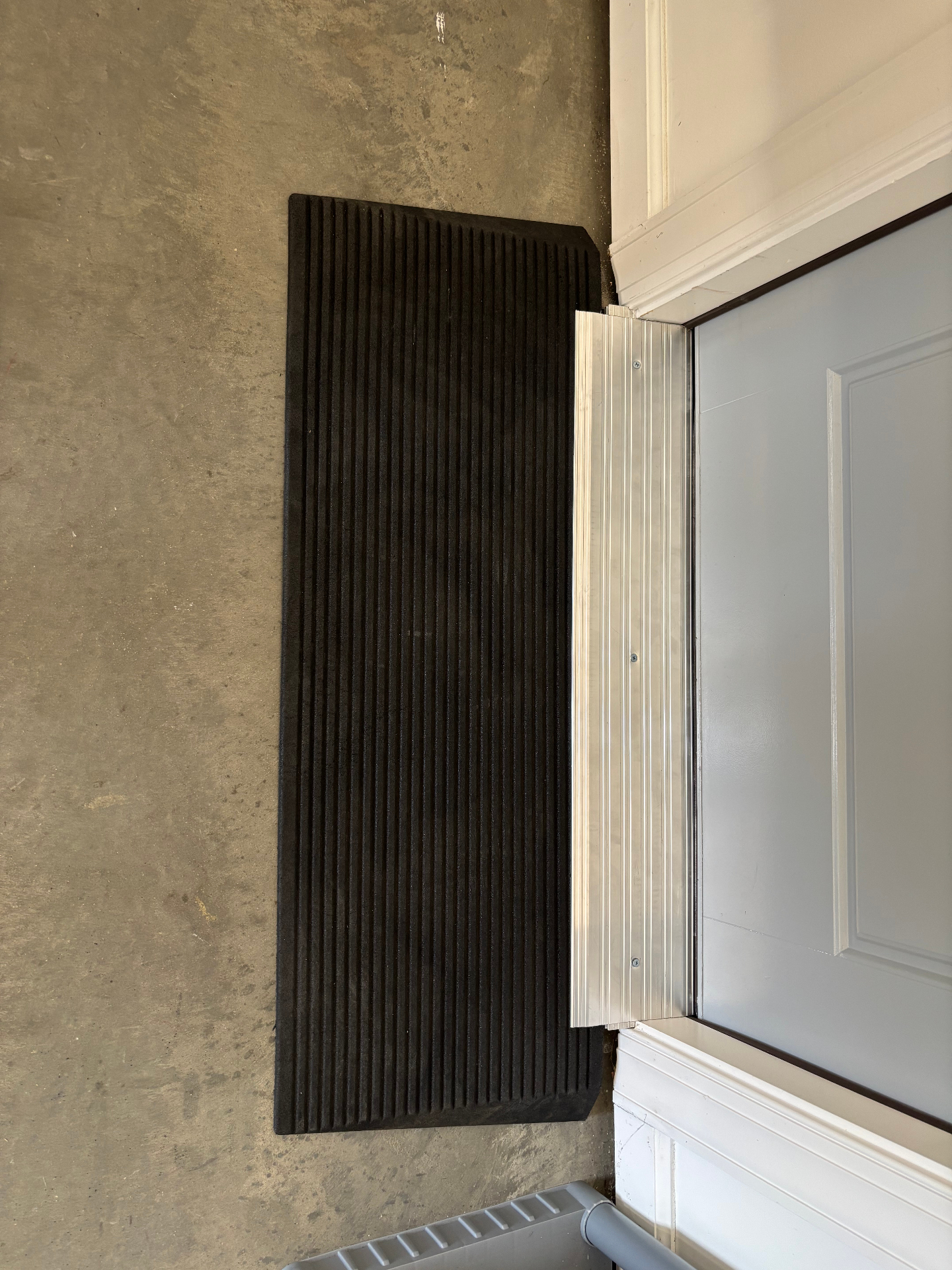 Threshold ramp installed at a doorway for smooth wheelchair entry