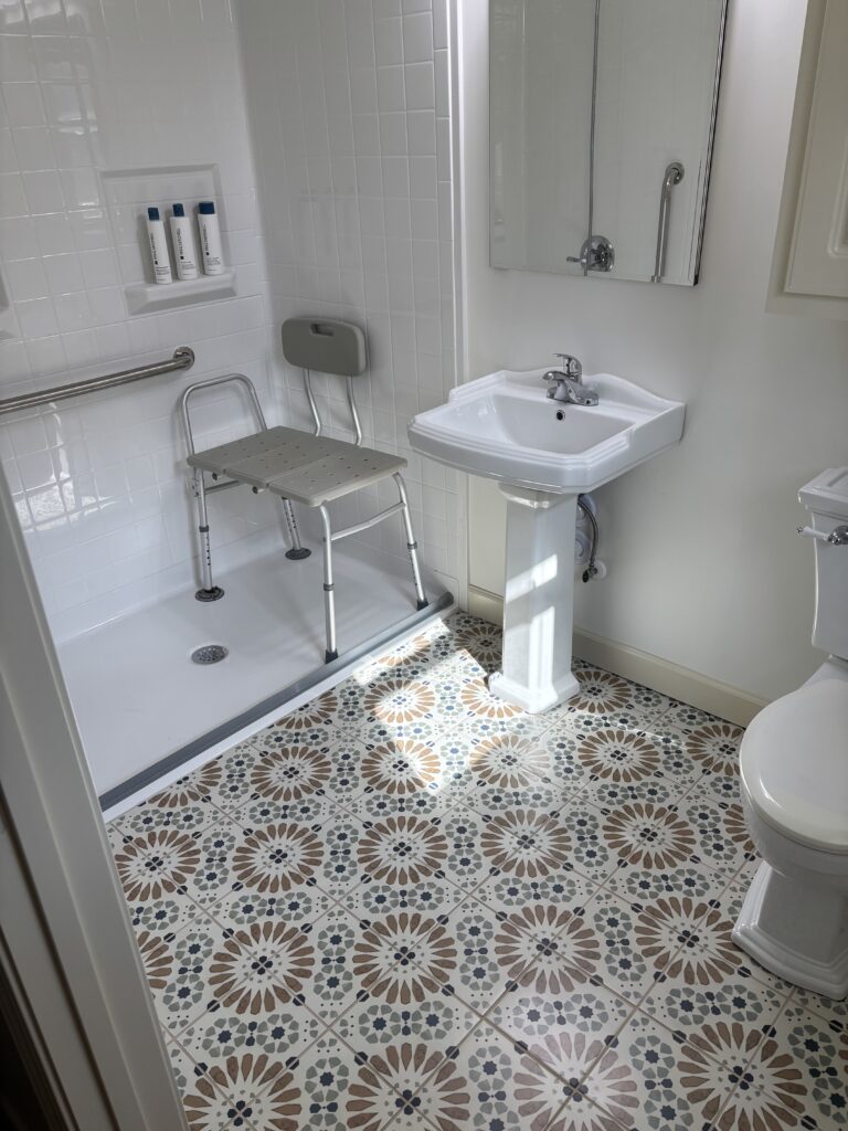 This lovely bathroom is perfectly outfitted for the safety of a senior citizen.